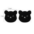 Two black bear-shaped laundry ball washing pads for effective pet hair removal