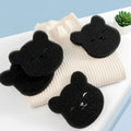 Black bear-shaped laundry balls for effective pet hair removal and washing machine lint capture