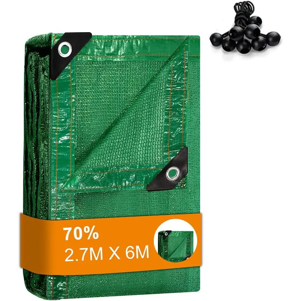 Folded green tarp with black ball bungees for greenhouse shading and sun protection