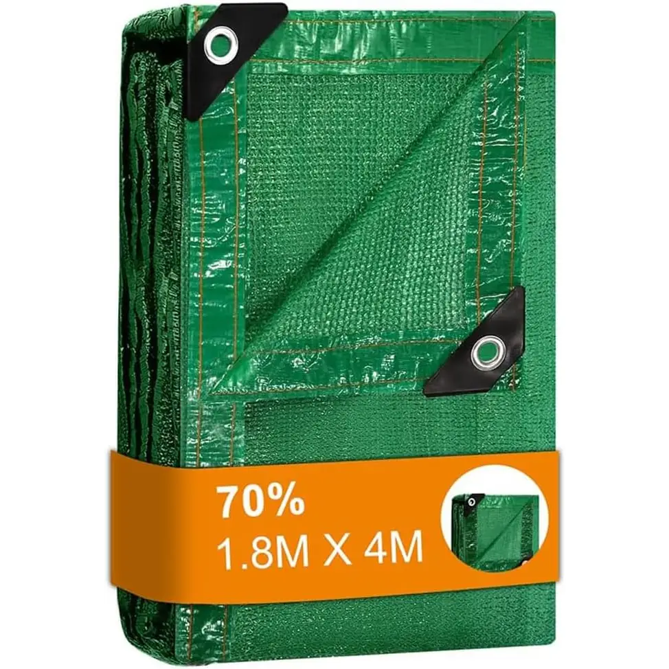 Folded green tarp with grommets for greenhouse shading and garden sun protection