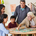 Family enjoying Hasbro Gaming Bop It, an electronic game unit for classic dexterity games