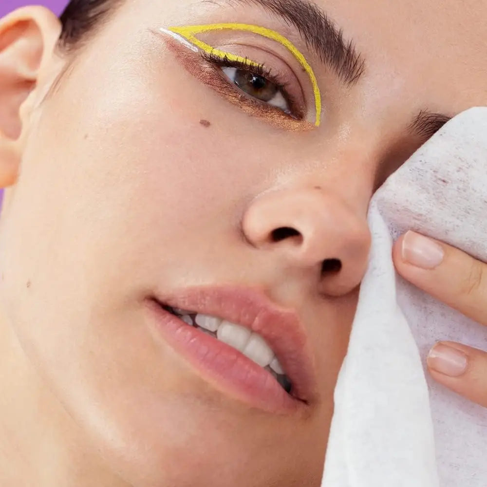 Woman removing makeup with NIVEA MicellAIR Skin Breathe Professional Biodegradable Cleansing Wipes