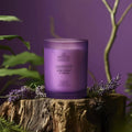 Lavender-scented purple candle with cream frosted glass and wooden crackling wick