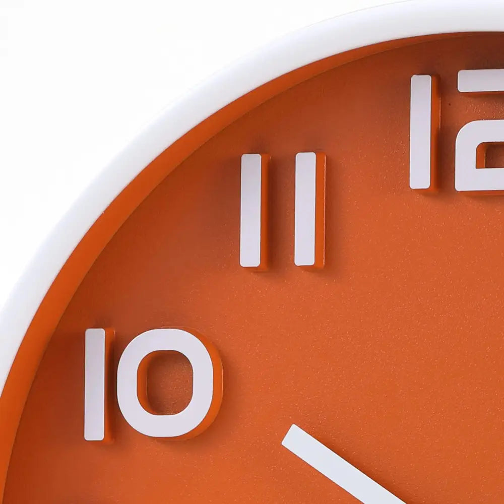 Orange decorative wall clock with white numbers in silent non-ticking quartz style