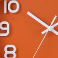 Orange decorative wall clock with white numerals and hands, silent non-ticking quartz design